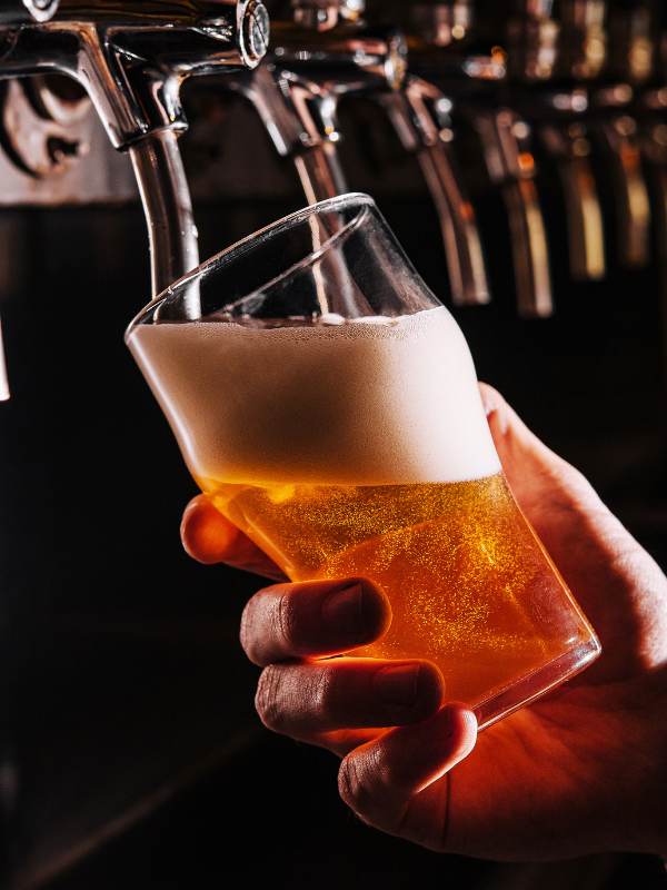 Beer pouring from tap